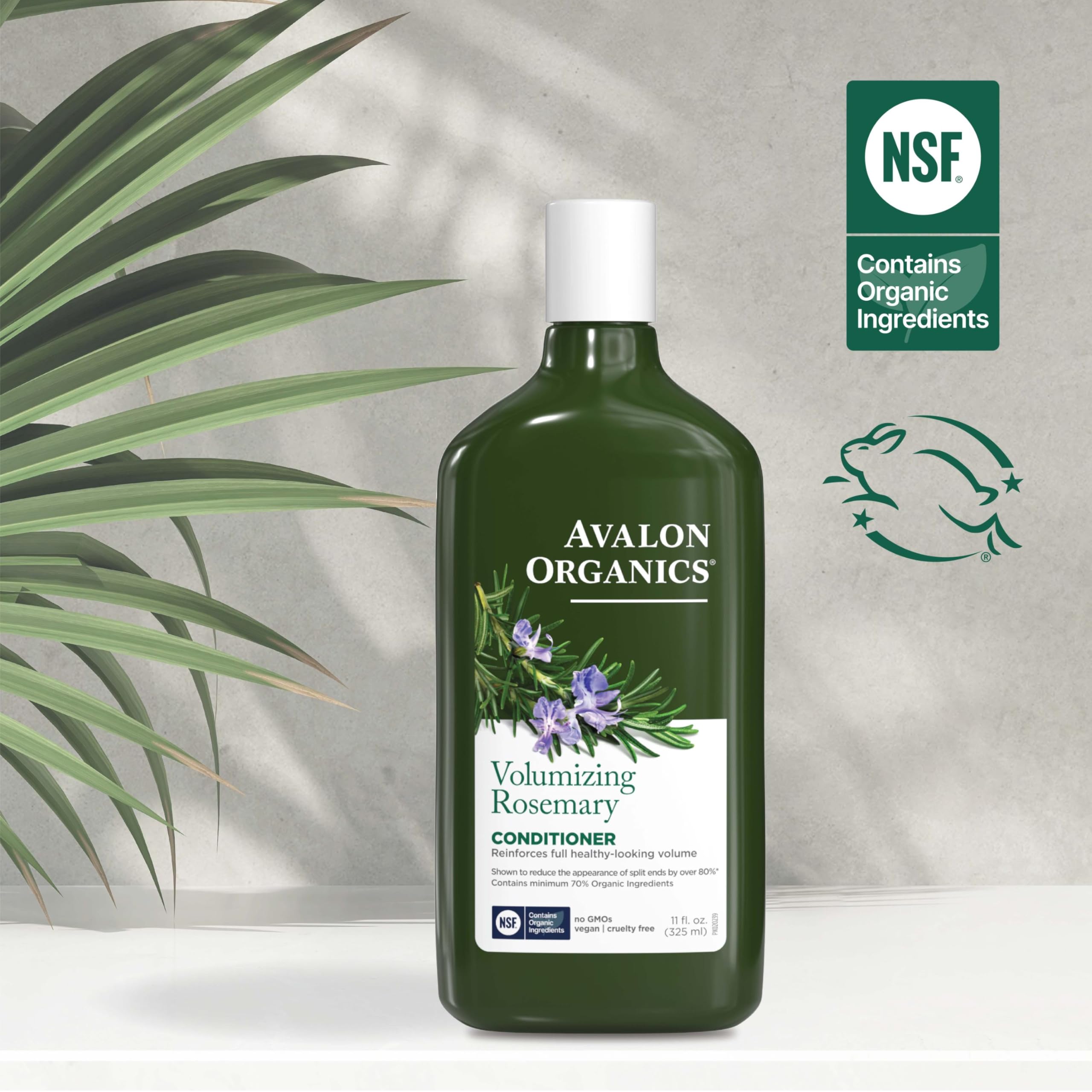 Avalon Organics conditioner in hand being applied for fuller-feeling hair