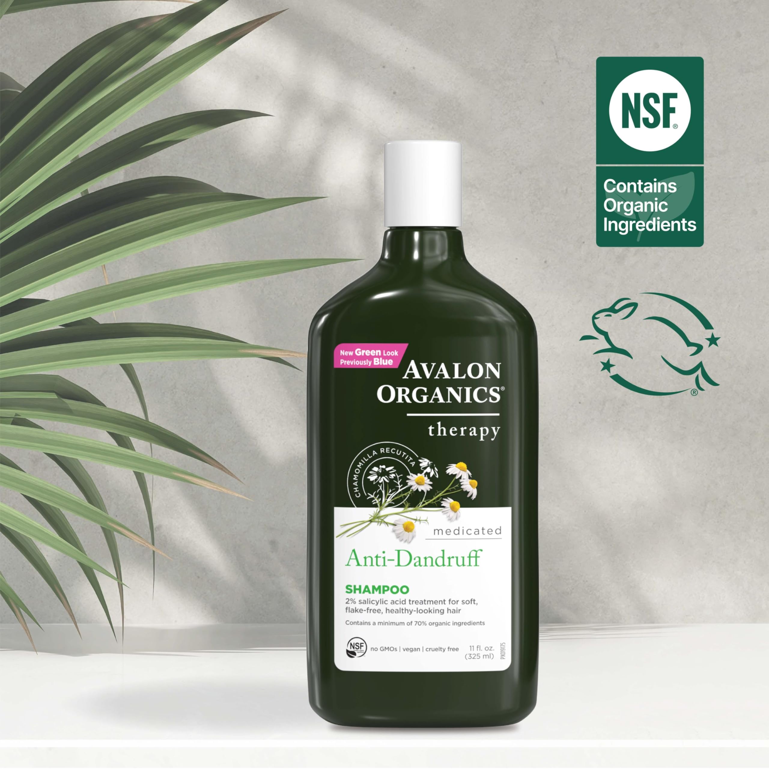 Avalon Organics shampoo in shower being massaged into scalp for flake removal