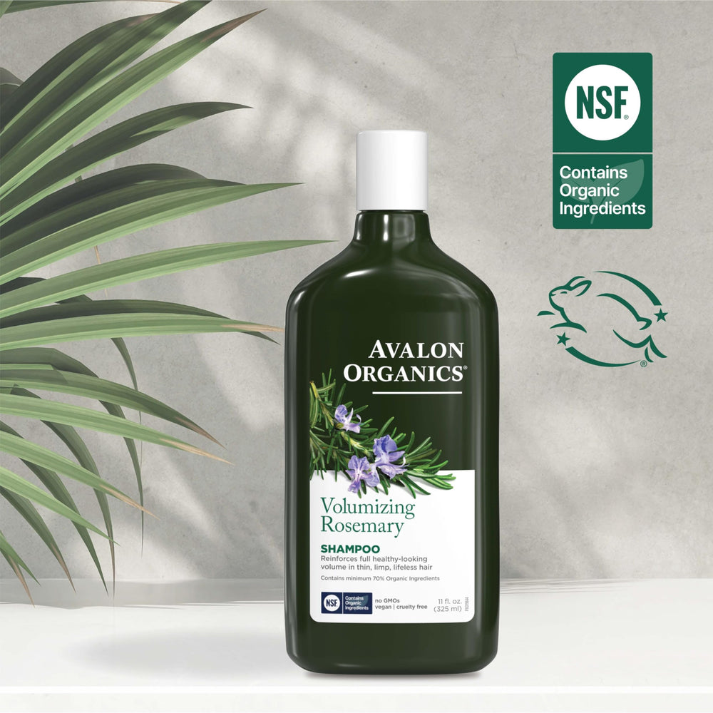 Person using Avalon Organics shampoo in shower to lift roots and add body