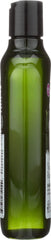 Avalon Organics bottle in hand to show 11 oz size and travel-friendly benefit