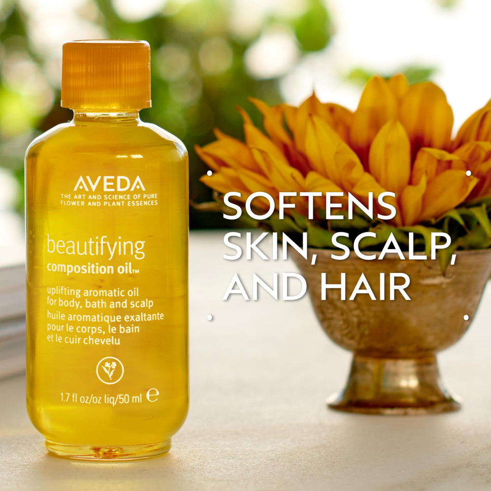 Aveda Beautifying Composition Oil open cap dispensing drop for controlled use