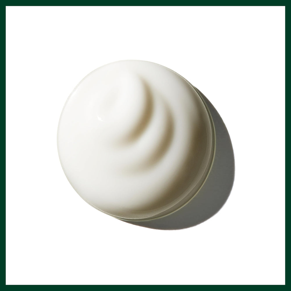Aveda brilliant creme after blow-dry showing smooth, shiny curls and polished finish benefit