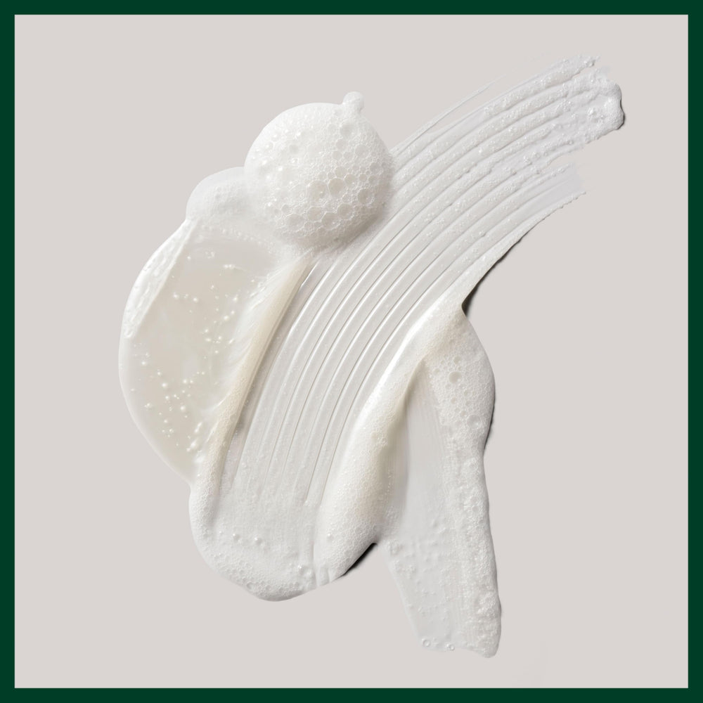 Aveda Shampure bottle in a shower scene showing relaxing botanical ritual
