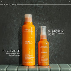 Aveda bottle held in hand to show size and travel-friendly benefit