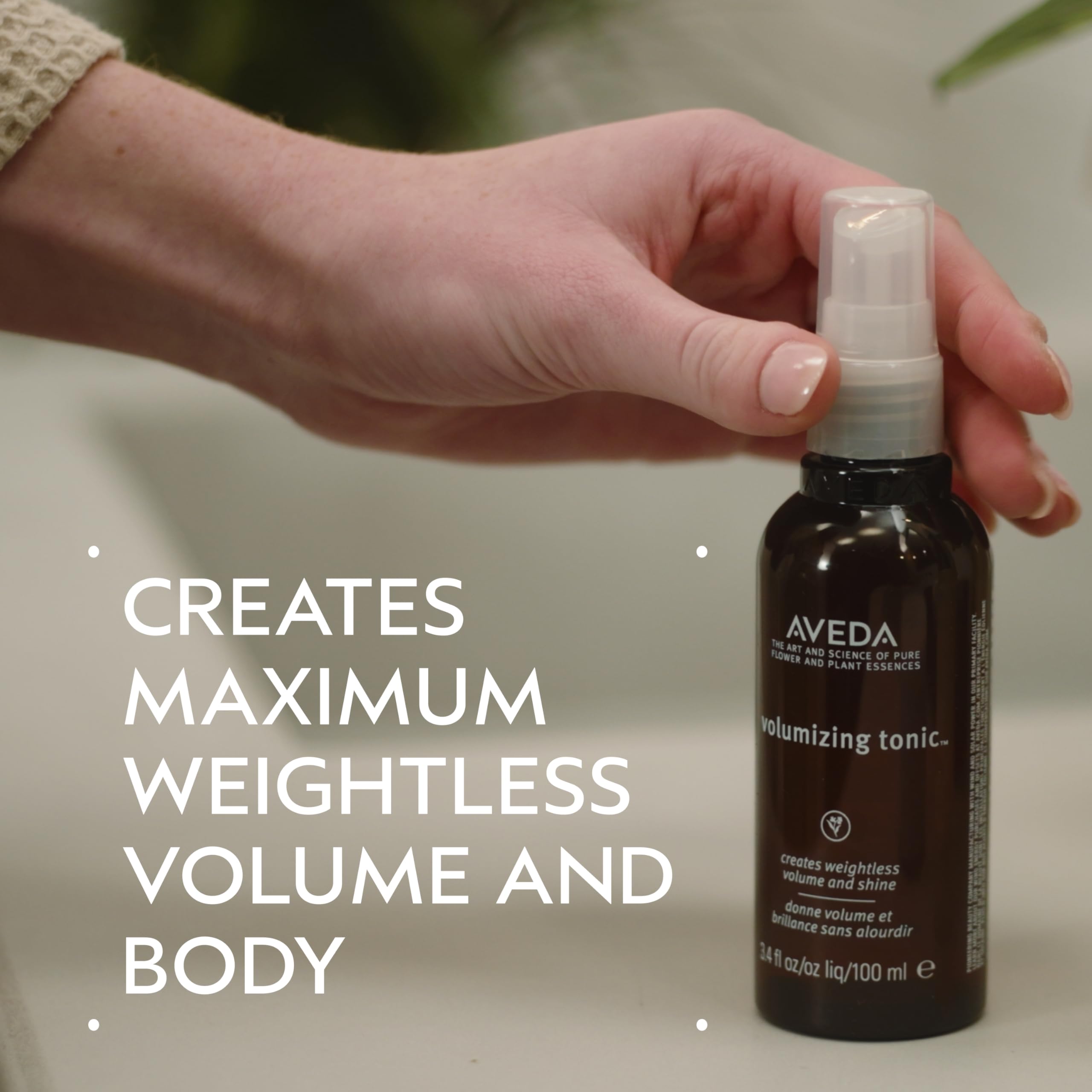 Aveda volumizing tonic spraying fine mist demonstrating easy root application benefit