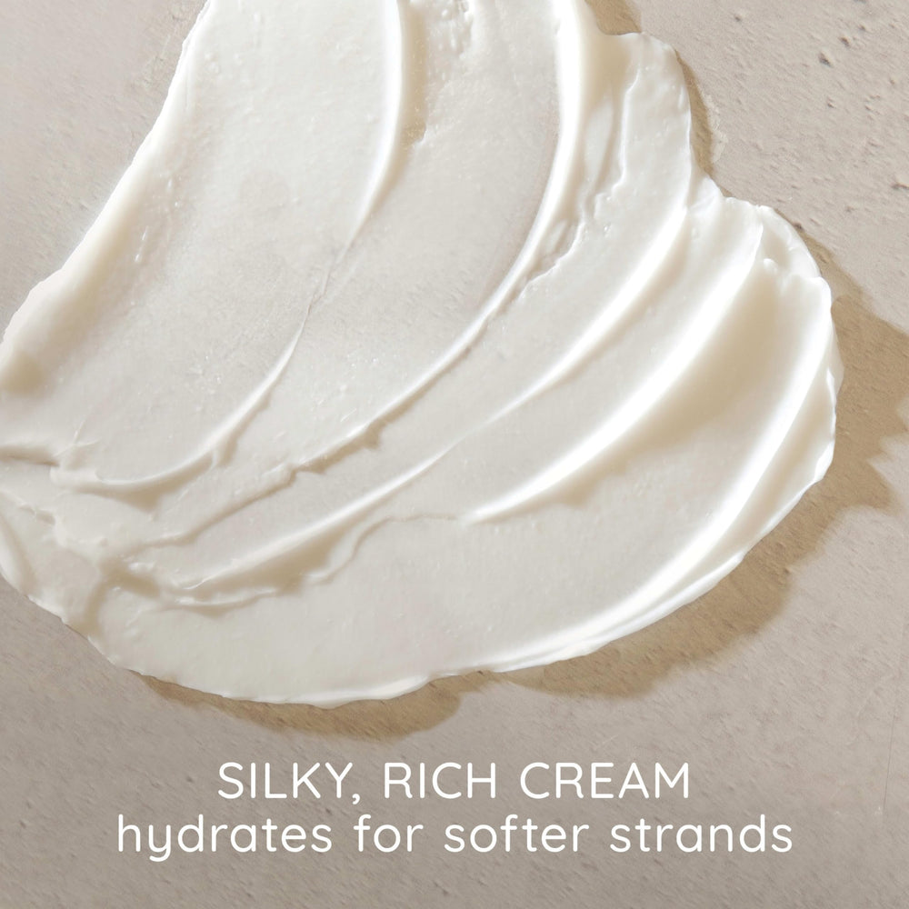 Aveeno conditioner texture close-up highlighting creamy formula for smooth hair