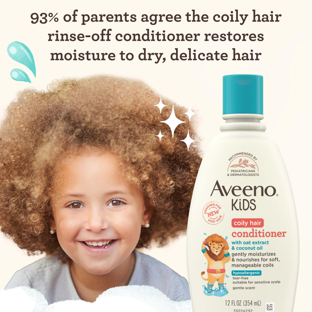Aveeno Baby label close-up highlighting oat extract and coconut oil benefits