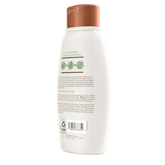 Aveeno bottle styled on bathroom shelf conveying calm, natural routine
