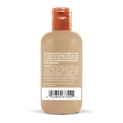 Aveeno oat milk texture pouring to show lightweight, creamy leave-in treatment