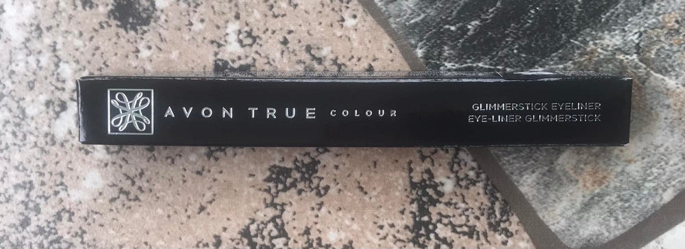 AVON GLIMMERSTICKS swatch on skin demonstrating rich Starry Night Blue pigment payoff