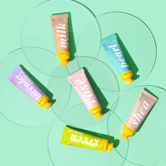 AvryBeauty tube beside a wallet showing compact travel size advantage