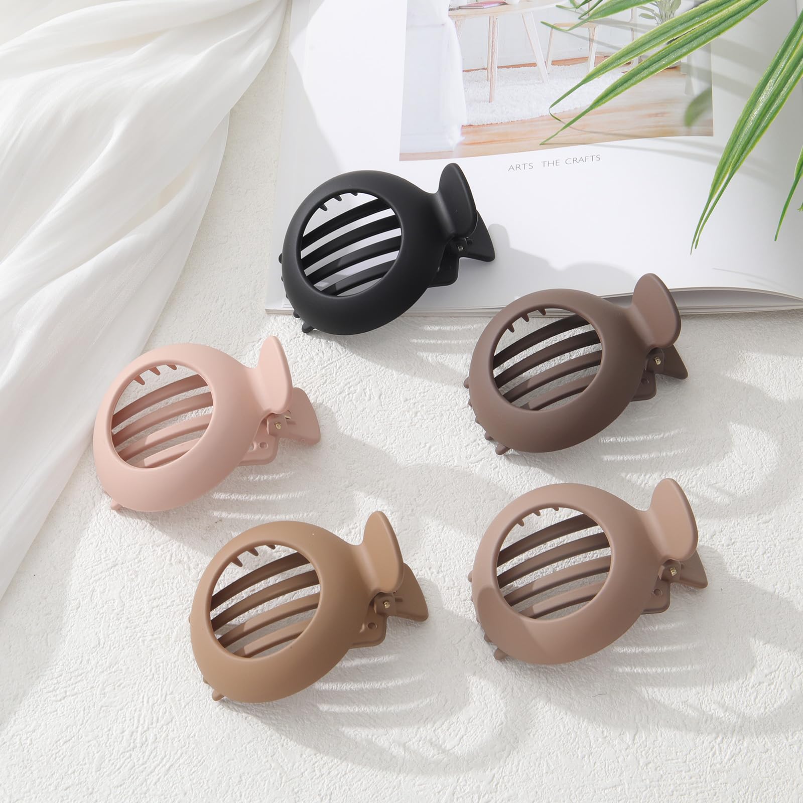 AWAYTR five matte neutral clips arranged to match everyday outfits
