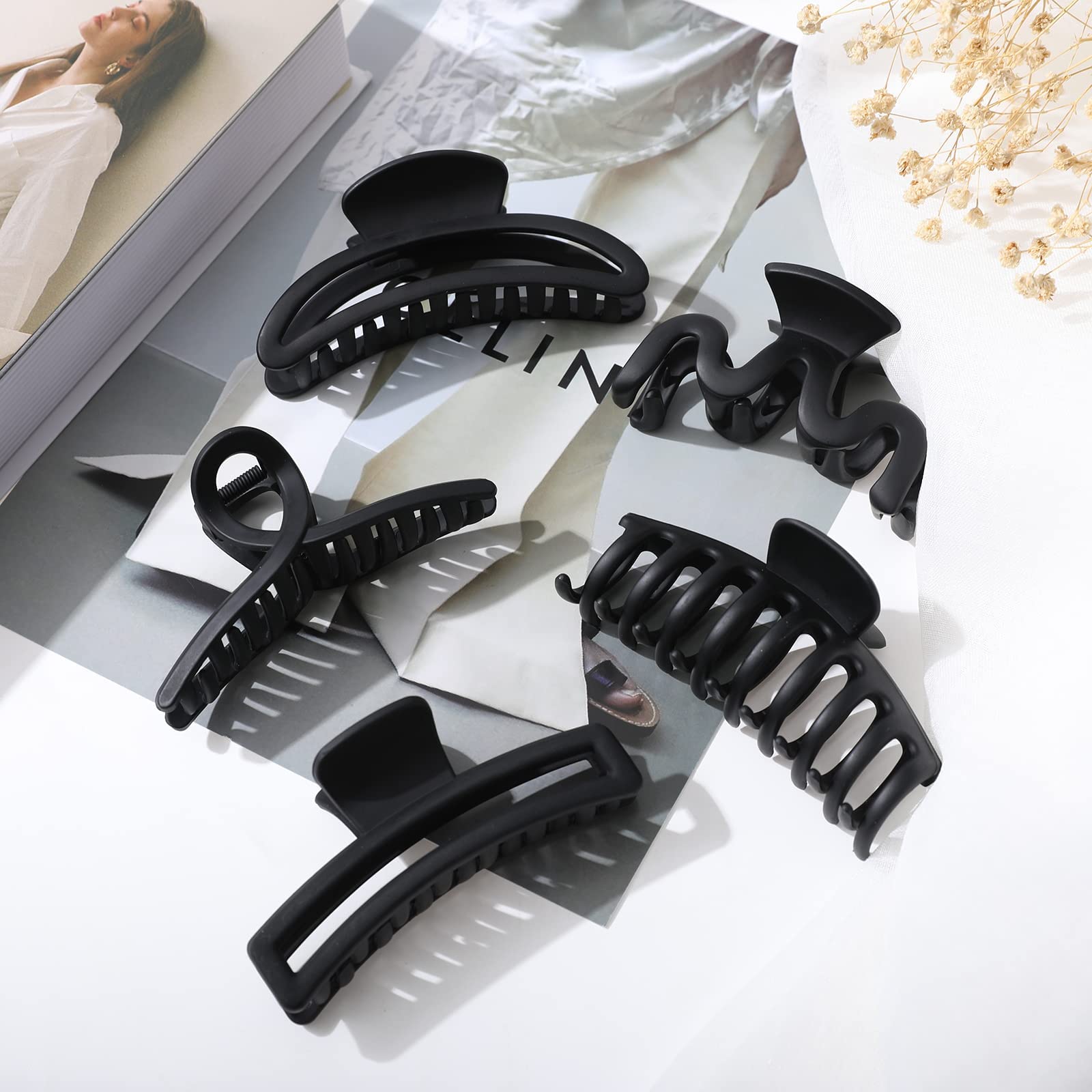 AWAYTR five clips arranged in lifestyle scene offering styling versatility benefit