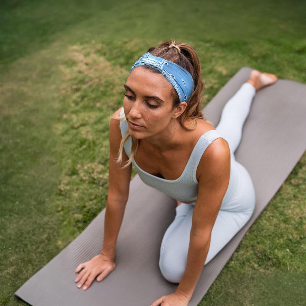 Awumbuk side profile worn during yoga showing secure no-slip fit benefit