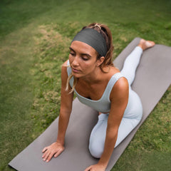 Awumbuk worn during yoga demonstrating secure fit and sweat control
