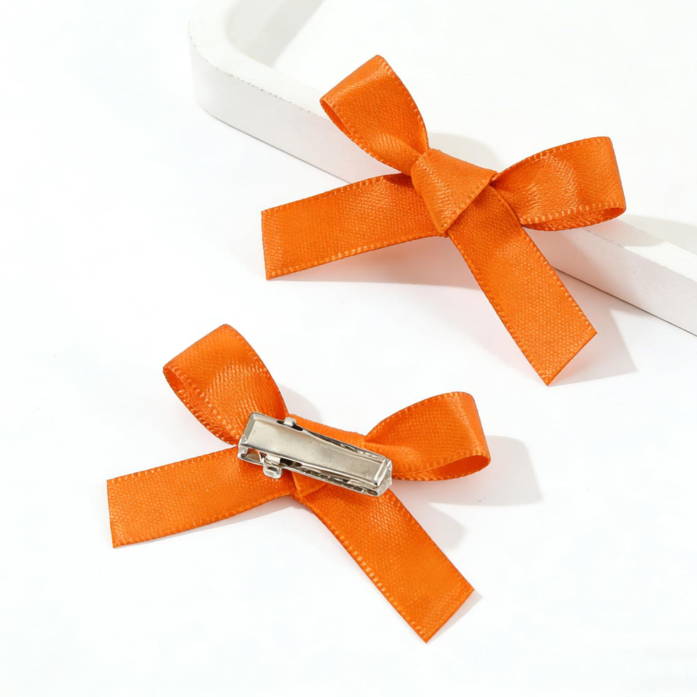 Ayesha bow worn in ponytail demonstrating secure fit with elastic or clip, practical styling