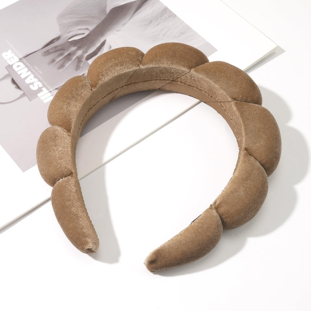 Ayesha headband stretched to show 11 inch fit and adjustable benefit