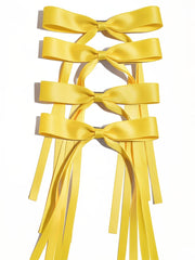 Ayesha yellow bow clip front view adds bright finishing touch