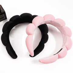 Ayesha headband shown on hand for size comparison indicating one-size fit