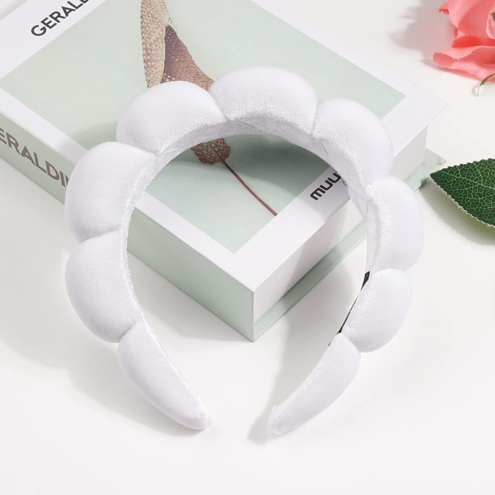 Ayesha headband next to hand shows true size and travel-friendly benefit
