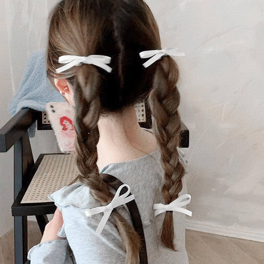 Ayesha size comparison on hand illustrating compact bow dimensions and travel convenience