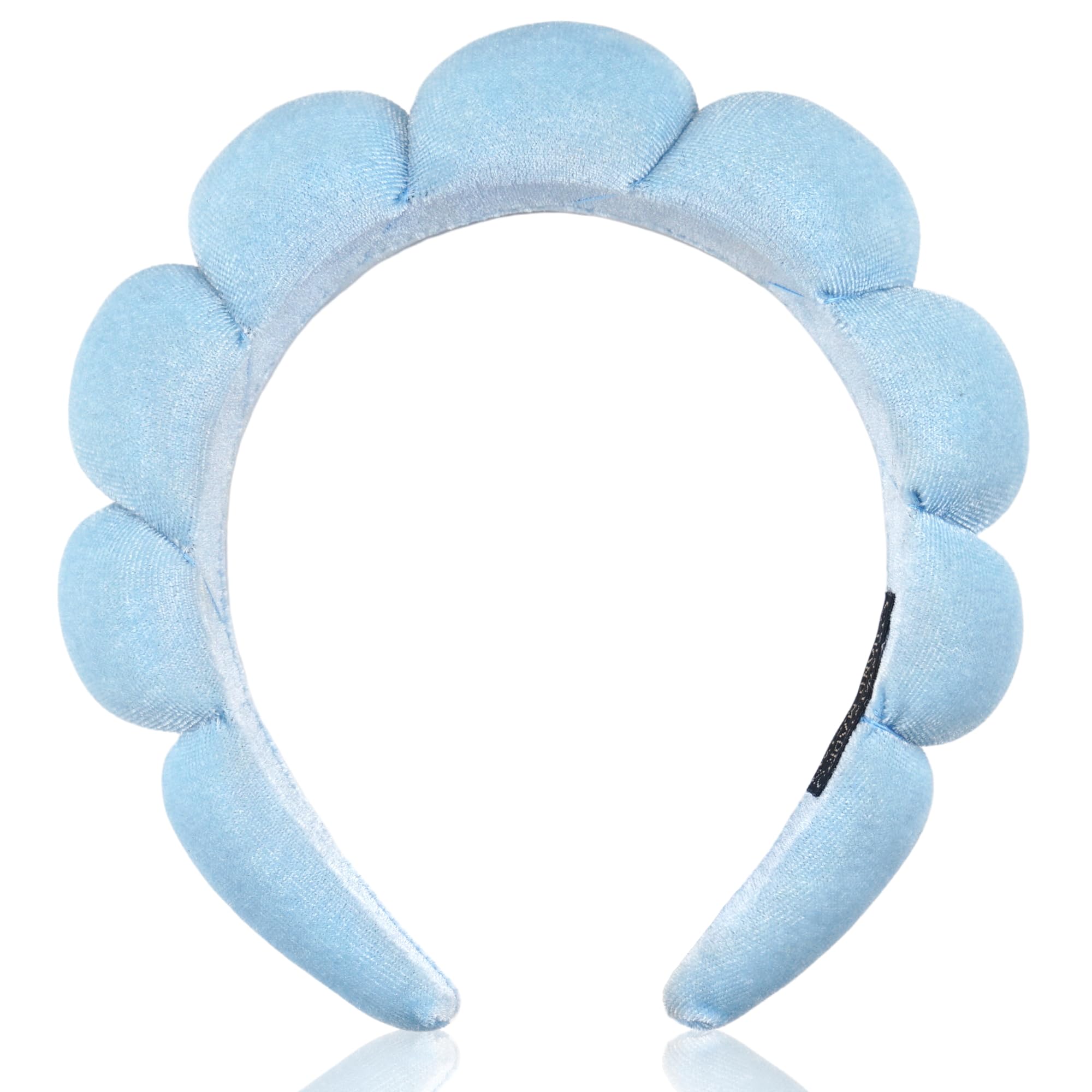 Ayesha headband on bathroom vanity setting suggesting spa-like routine benefit