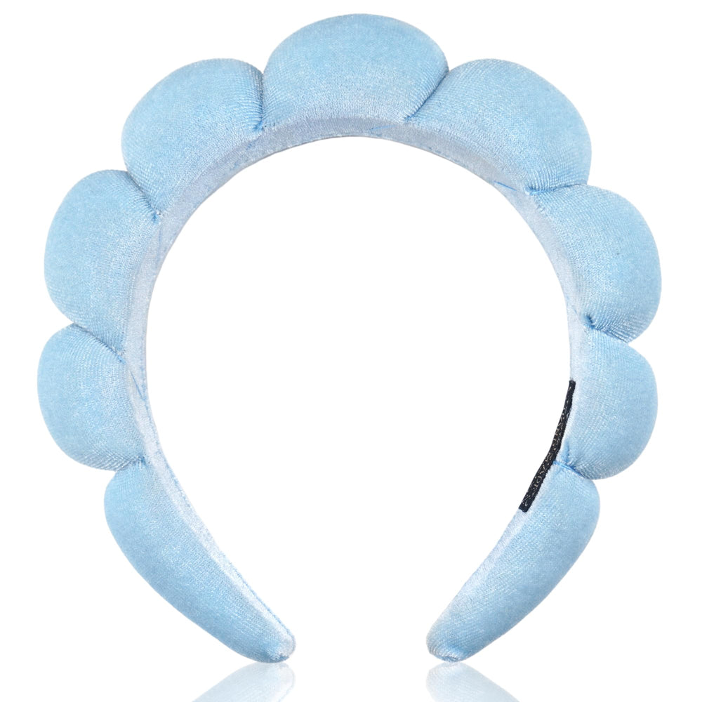 Ayesha headband on bathroom vanity setting suggesting spa-like routine benefit