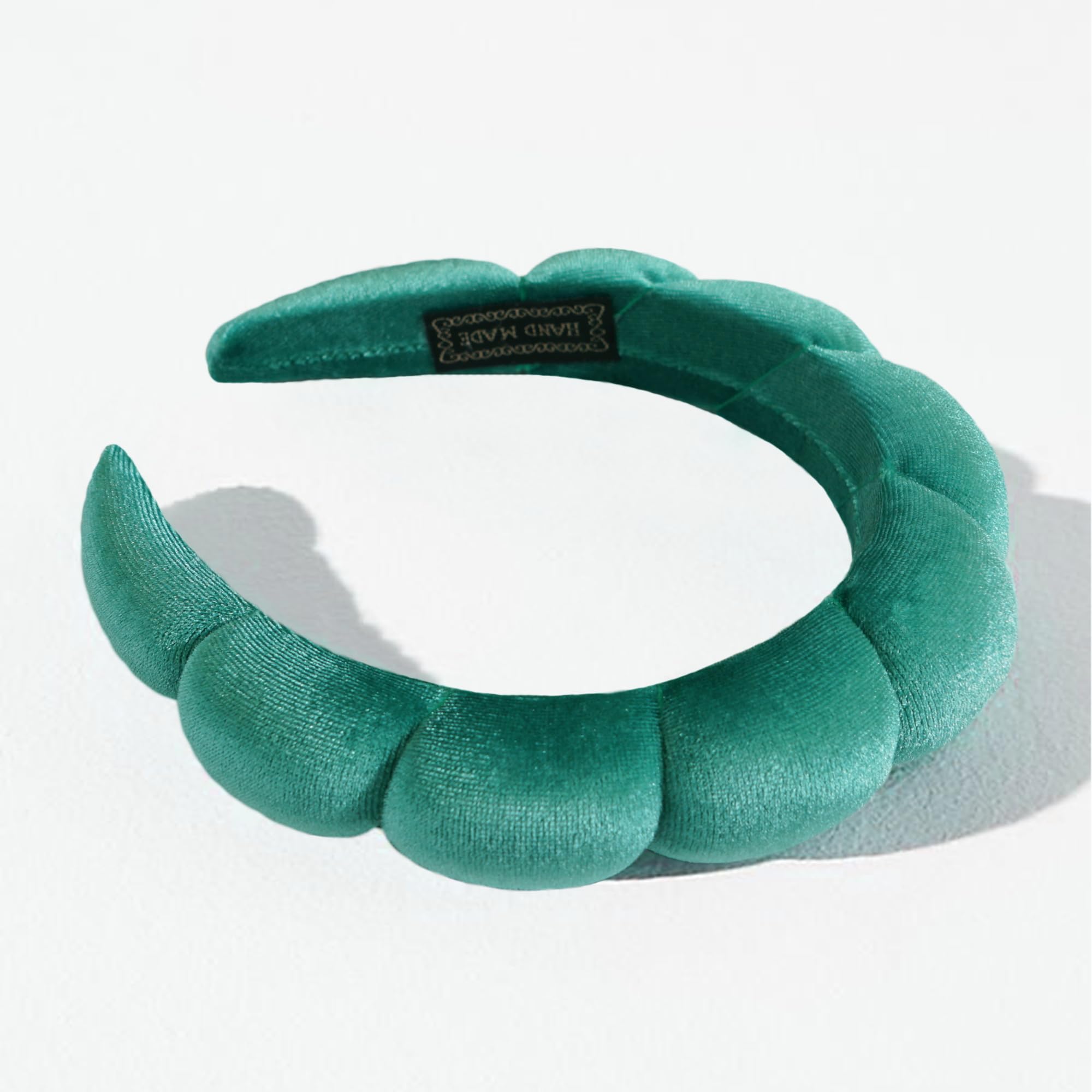 Ayesha headband next to ruler showing stretch up to 11 inches
