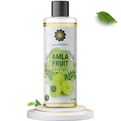 AYURVEDASHREE oil pour close-up highlighting silky texture and nourishment