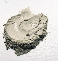 Aztec Secret fine bentonite powder texture close-up highlighting pure natural clay in detail
