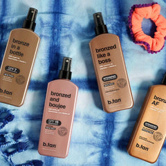 B.TAN bottle in beach setting suggesting outdoor use and bronzing effect