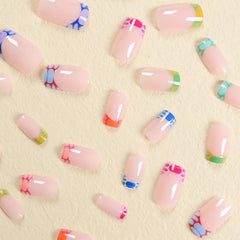 BABALAL hand applying press-on with glue for quick at-home manicure