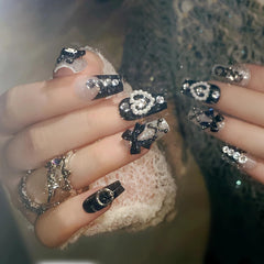 BABALAL close-up of bow and heart charms highlighting cute goth accents