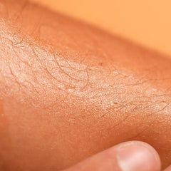 Babaria being applied on arm demonstrating even spread and glow