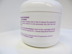 Baby Don't Bald parent applying serum to baby's scalp for gentler detangling