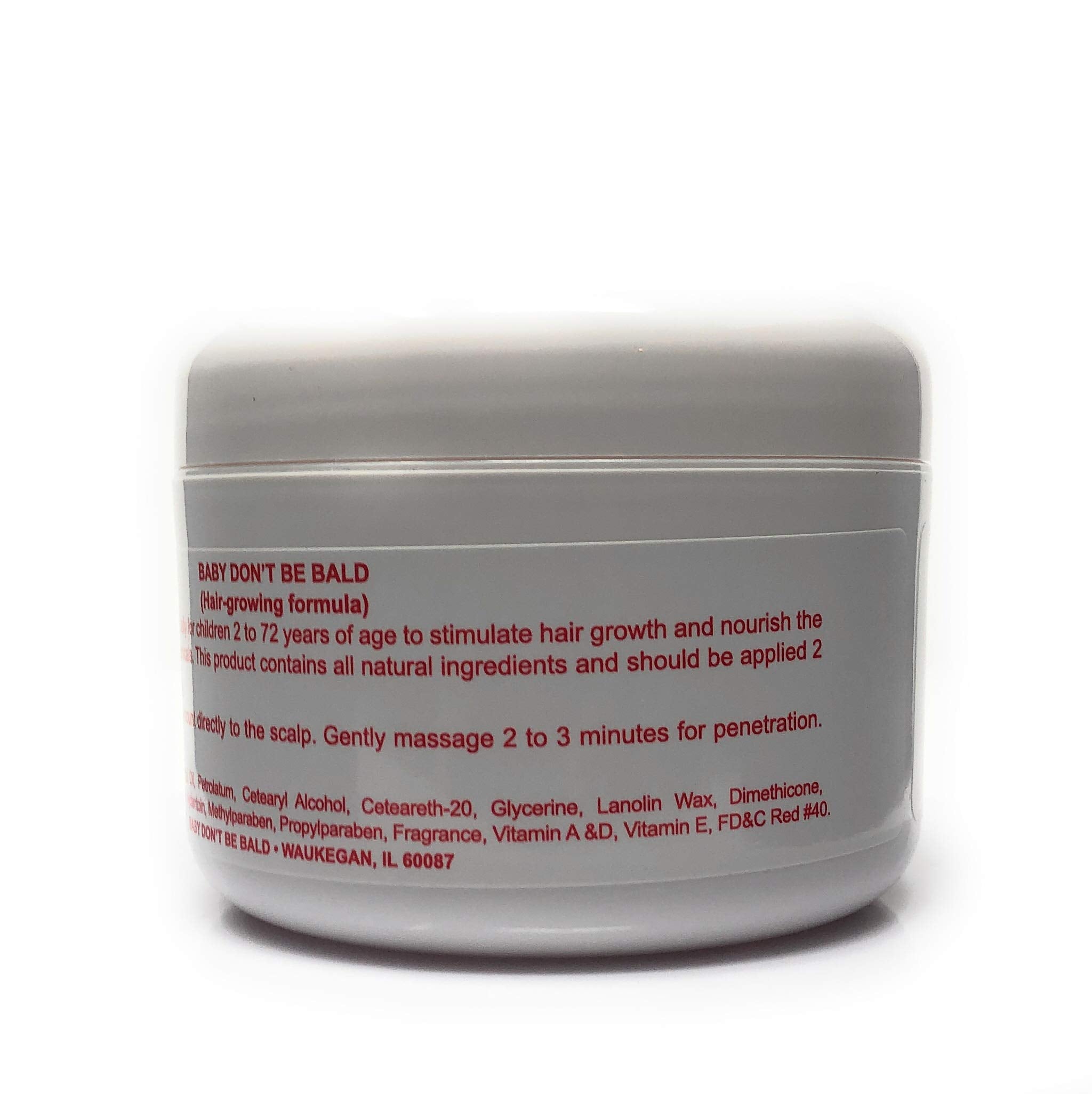 Baby Don't Be Bald 8 oz bottle held in hand to show scale, convenient for daily home use