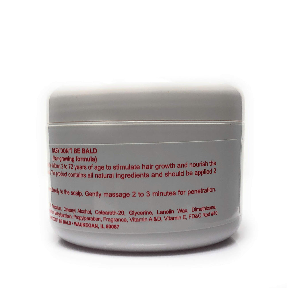 Baby Don't Be Bald 8 oz bottle held in hand to show scale, convenient for daily home use