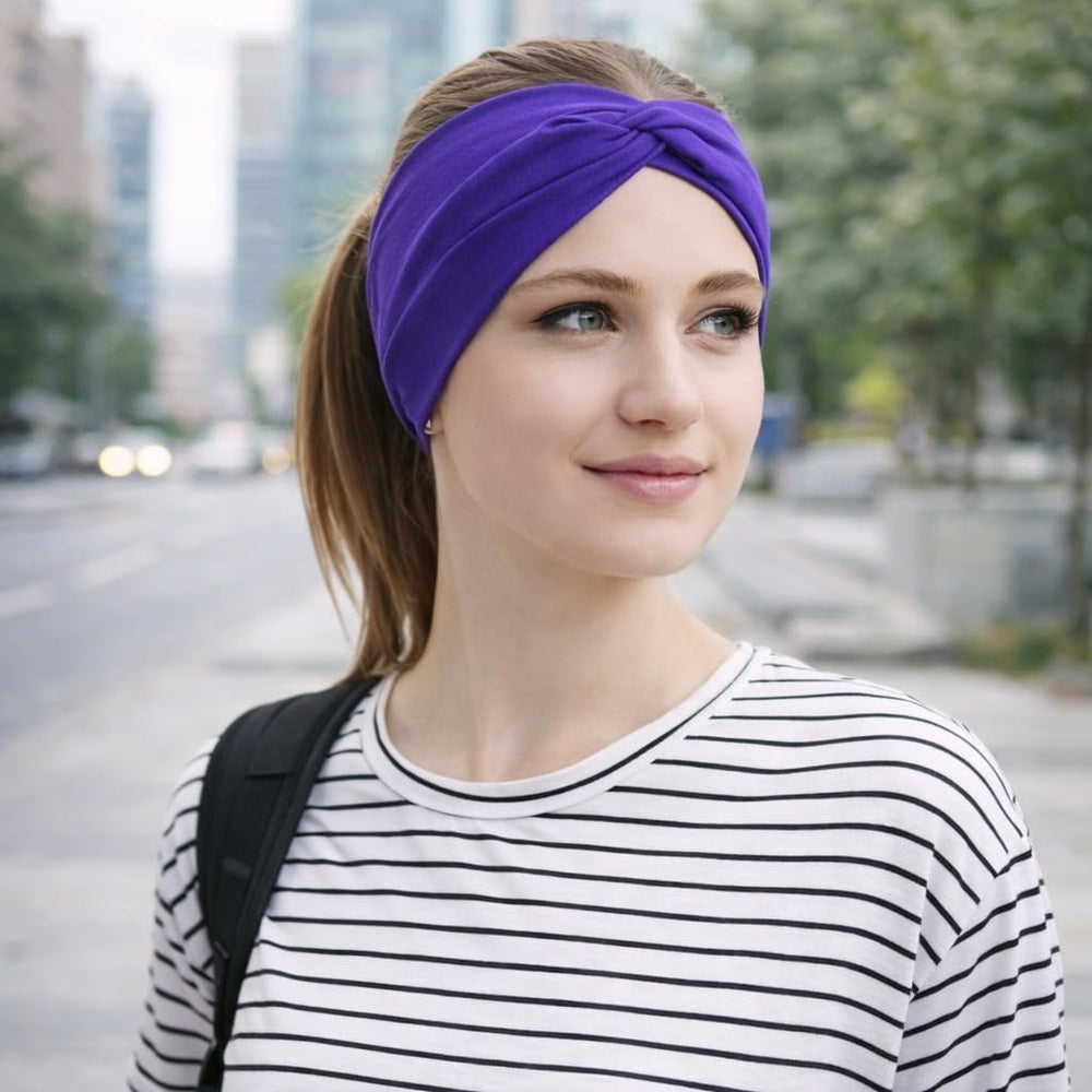 BABYGIZ headband worn in yoga studio demonstrating sweat‑resistant fit benefit
