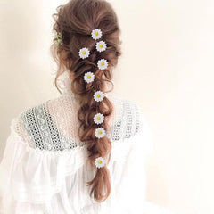 Backgarden hairpins styled in bridesmaid hair at beach wedding scene