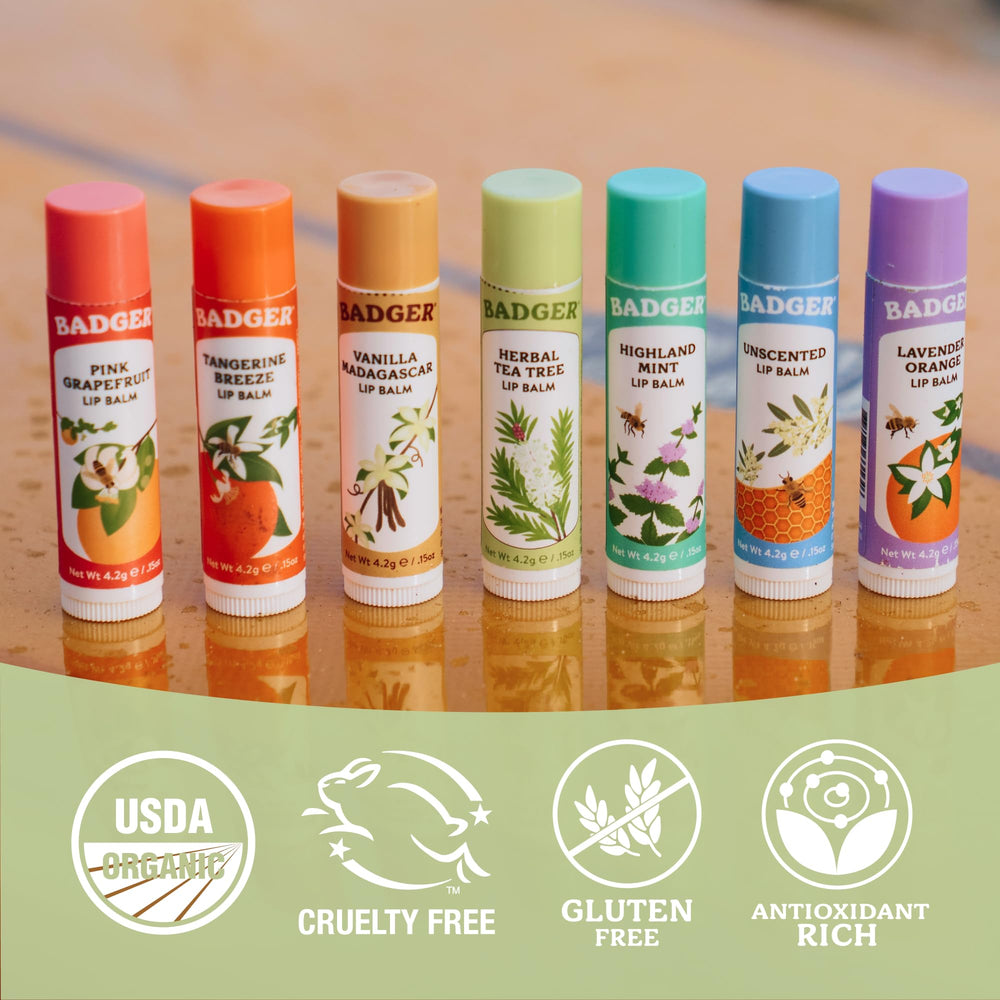 Badger lip balm tube held in hand showing pocket-friendly size