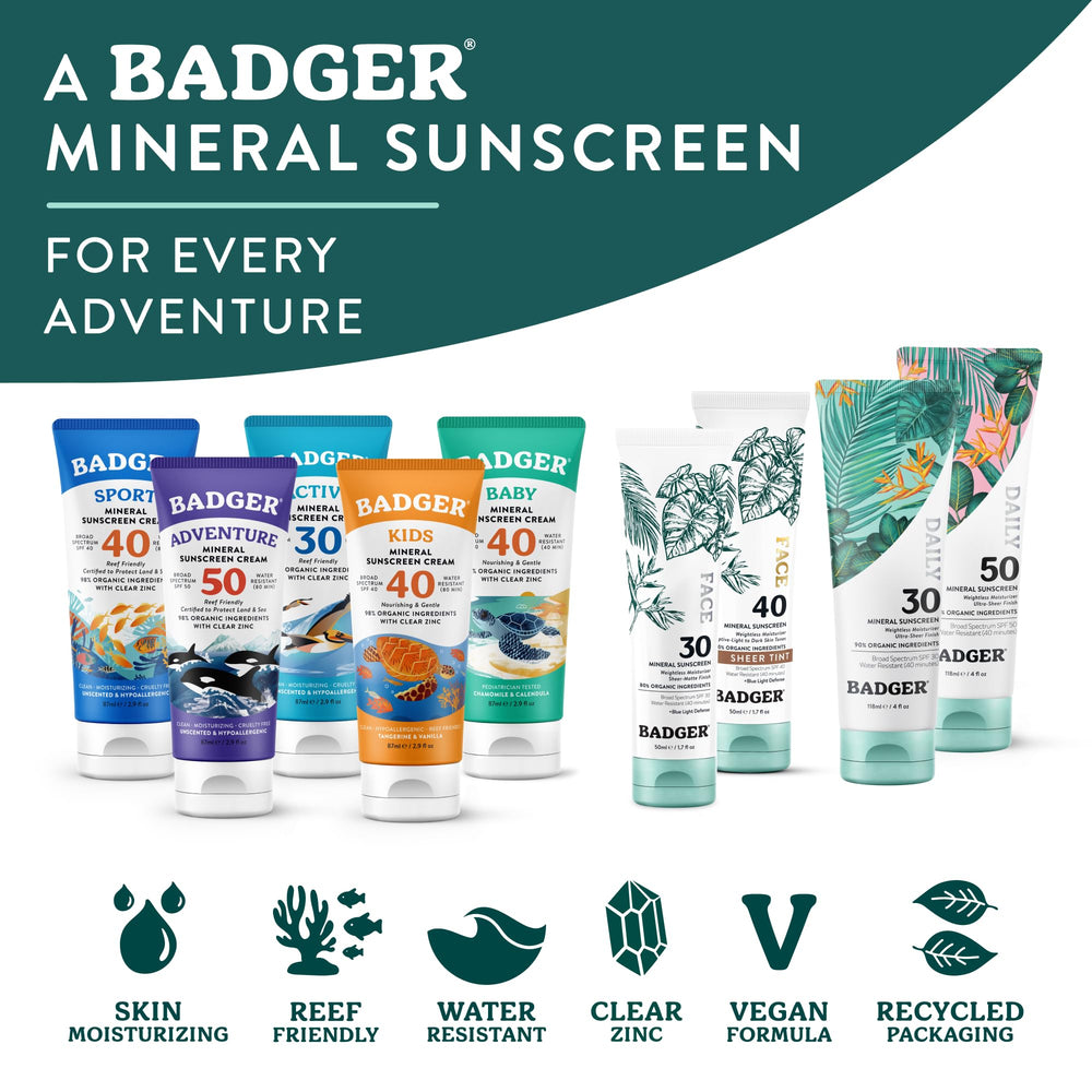 Badger tube next to hand to show compact 4 fl oz size
