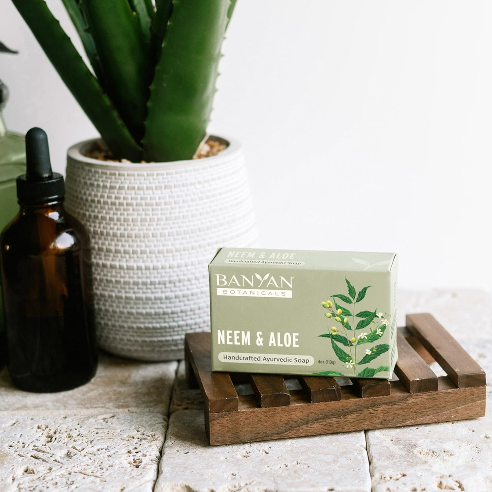 Banyan Botanicals soap held in hand to show true 4 oz scale
