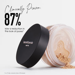 bareMinerals powder being picked up by a fluffy brush for even application