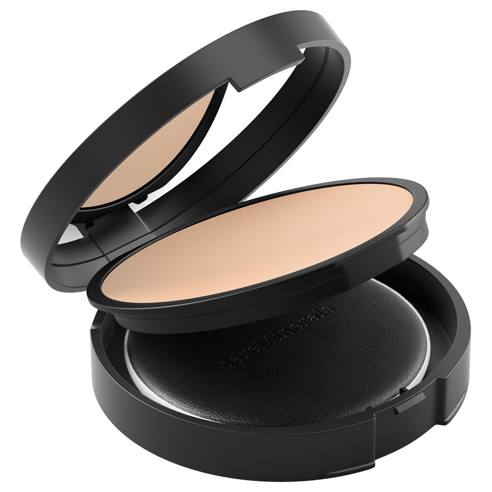 bareMinerals compact next to hand for scale showing travel-friendly size benefit