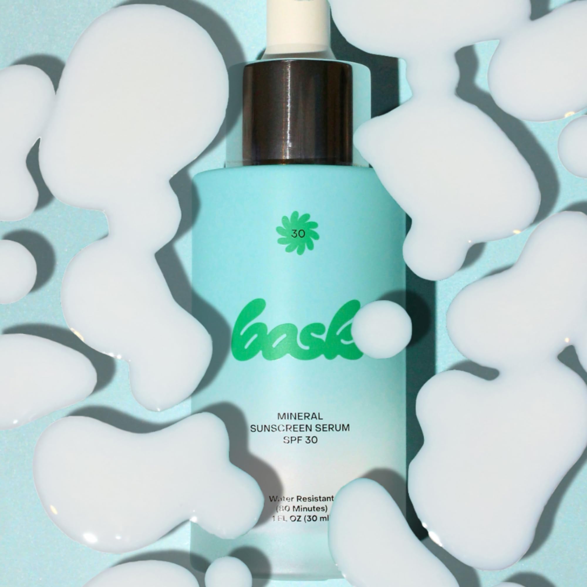 Bask 1 oz bottle next to coin showing compact travel size