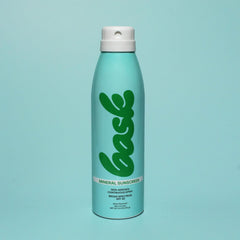 Bask applying spray on arm demonstrating easy reapplication