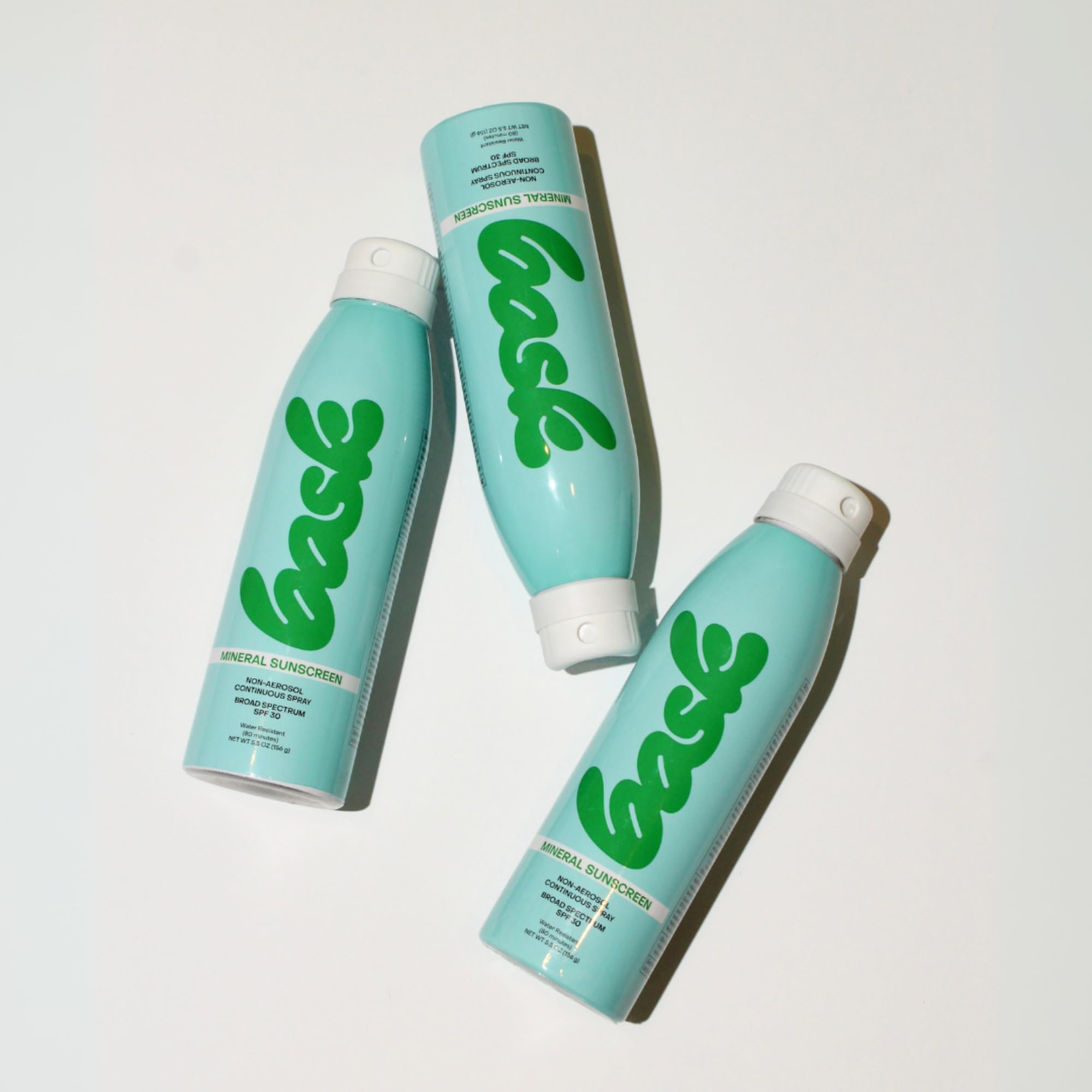Bask bottle in beach bag showing reef-safe outdoor protection