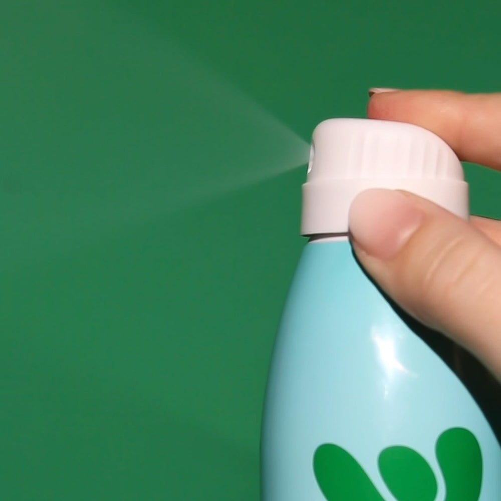 Bask bottle beside sunglasses showing travel-friendly size