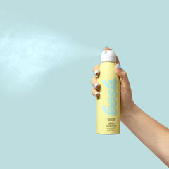 Bask spray in use at beach highlighting water resistance and coverage