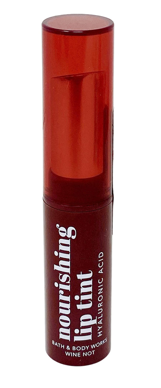 Bath & Body Works lip tint front tube showing warm red shade and portable design